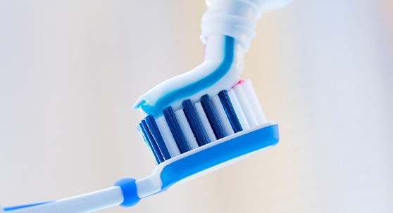 Toothpaste squeezed onto toothbrush
