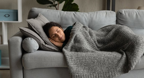 Woman sleeping peacefully on her couch