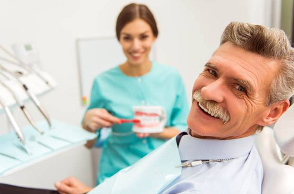 Implant dentures patient in Lakewood smiling