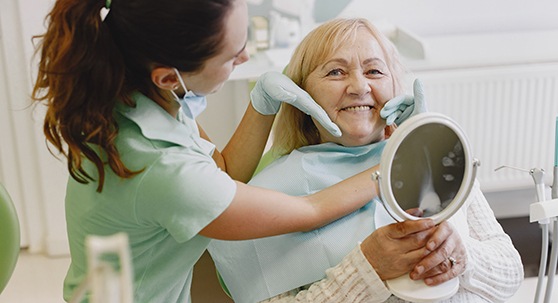 Implant dentures patient in Lakewood smiling