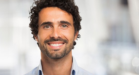 Young man showing off his straighter teeth