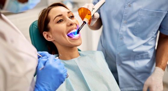 a patient receiving a tooth-colored filling