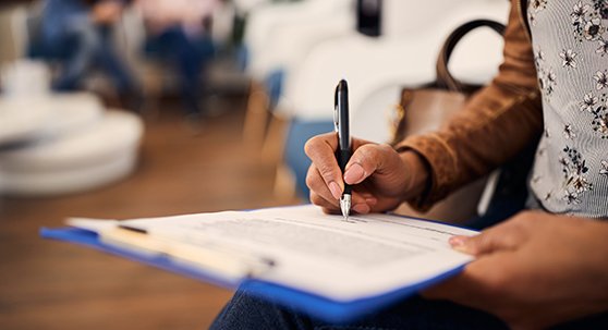 Patient in Lakewood filling out forms