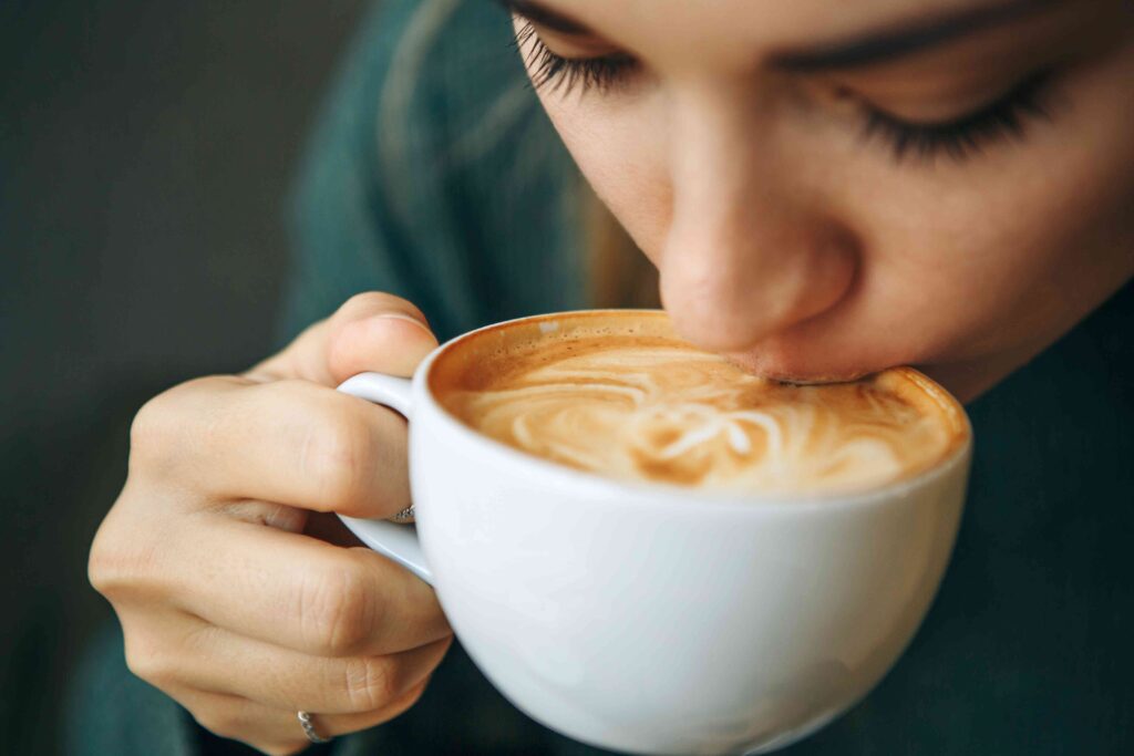 Woman sipping on coffee